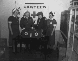 Photo of four members of the Geneva Red Cross Canteen