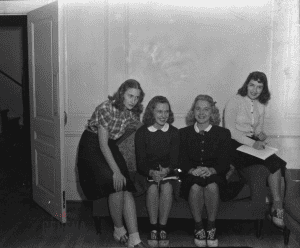 William Smith Students sitting on a couch